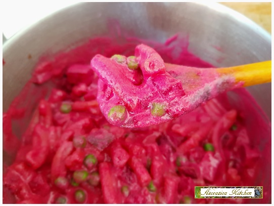 pasta dish with pink sauce and green peas